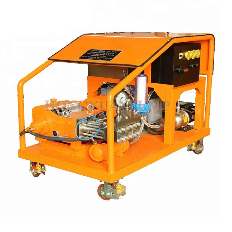 Hydro jetting high pressure machine in operation at a sewer cleanout
